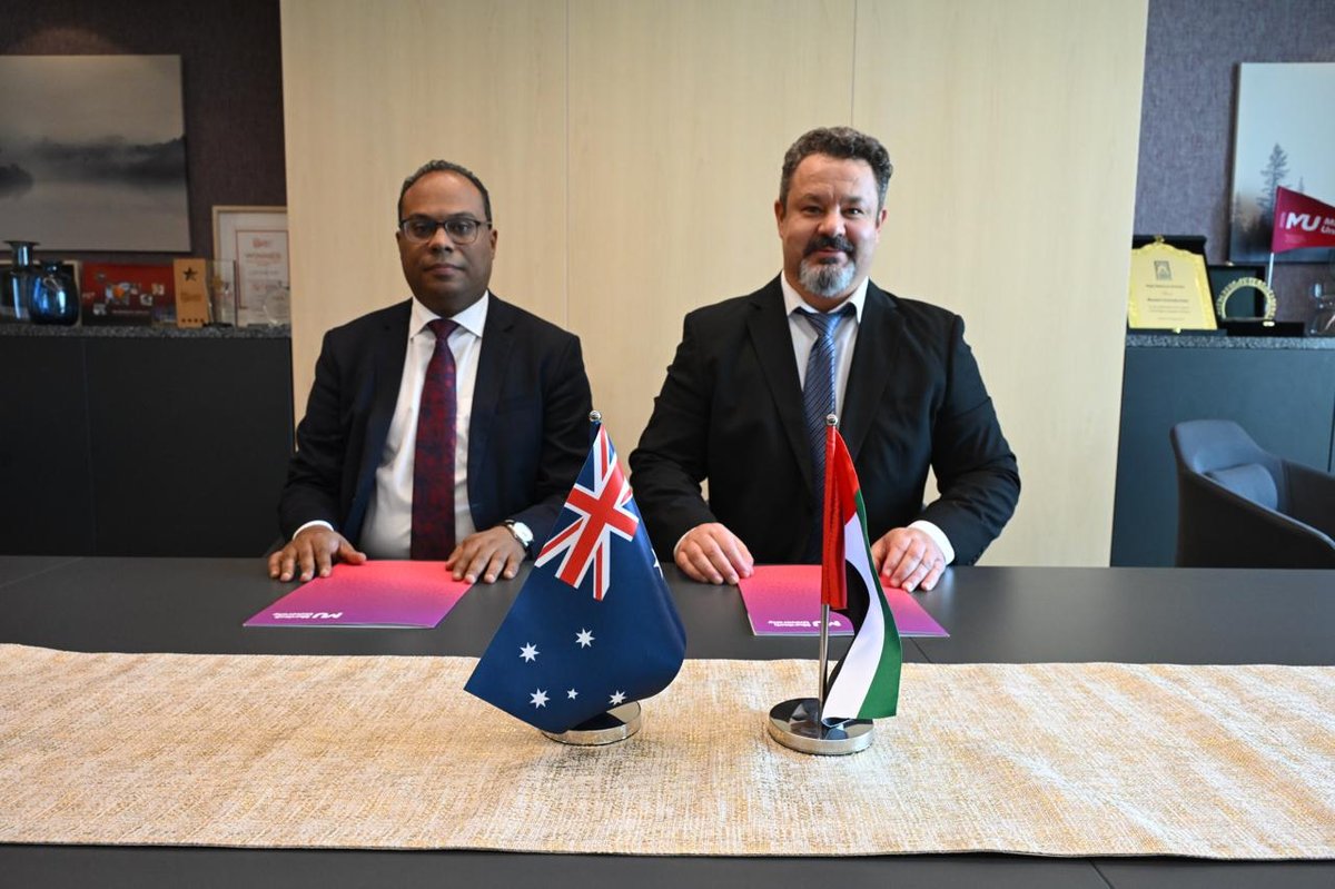 Formal Murdoch University Dubai signing with Australian and UAE flags